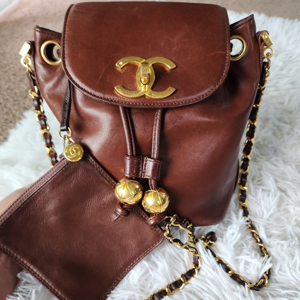 Vintage Chanel bucket bag drawstring with flap. 24k gold plated finish hardware.